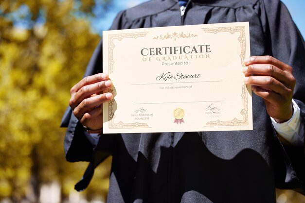 graduate holding certificate